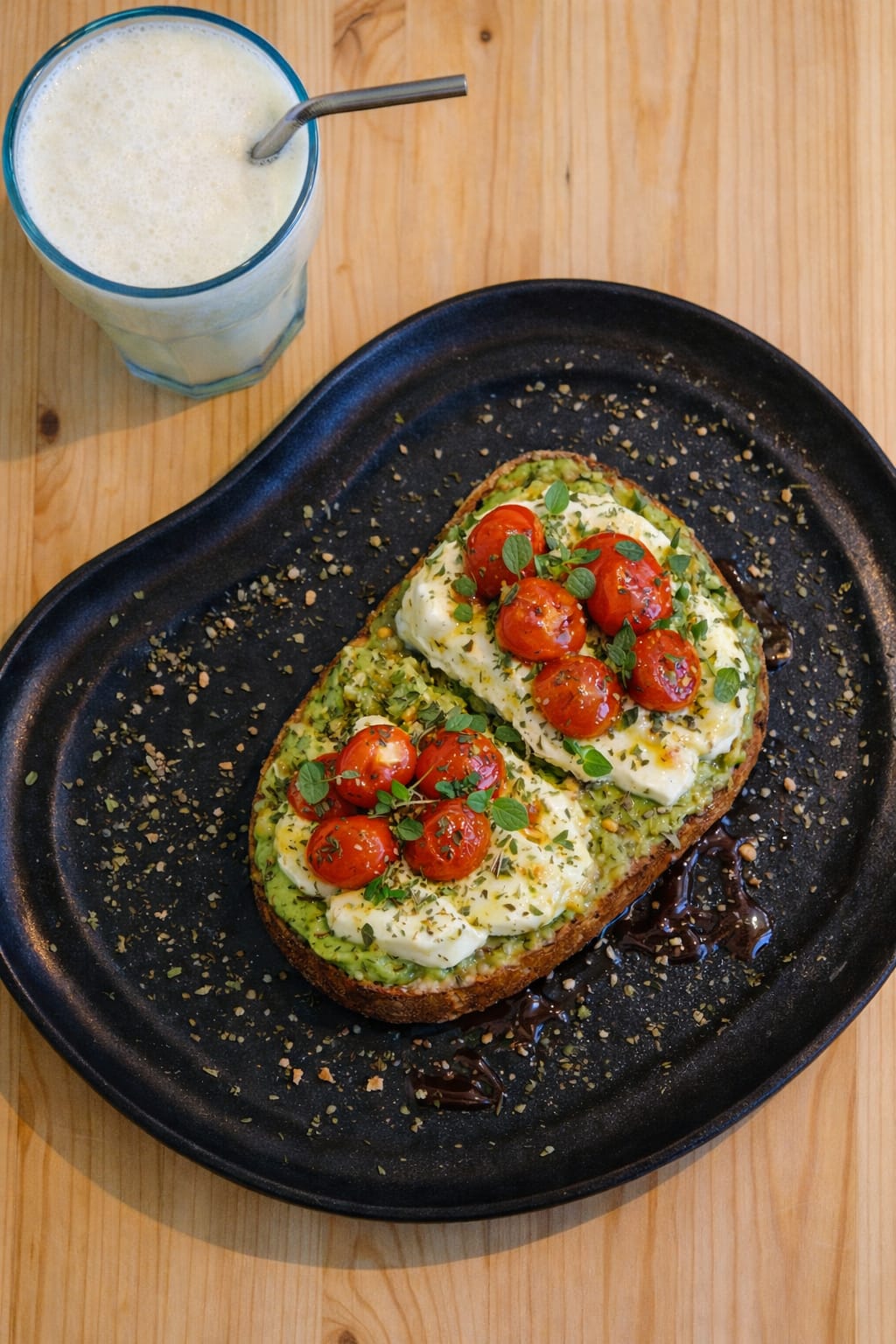 Avocado toast with mozzarella and cherry tomatoes